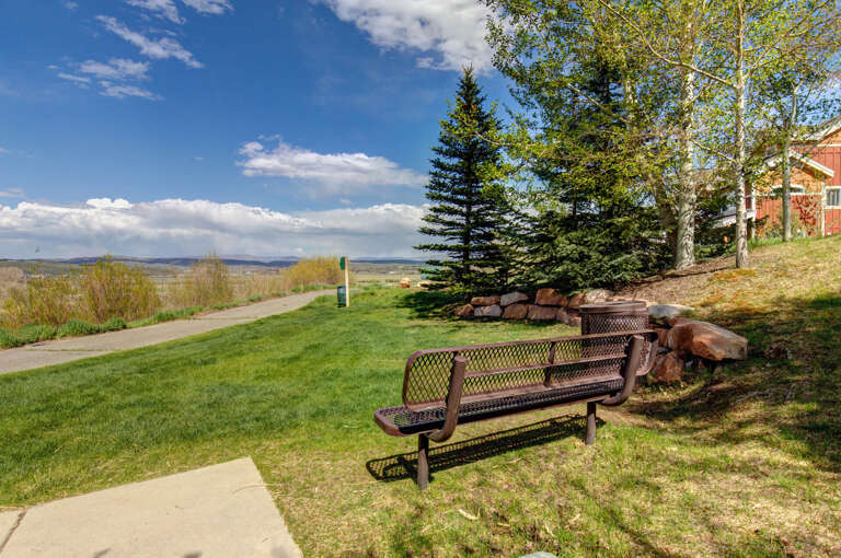 The property offers access to scenic walking paths and open natural landscapes, with mountain views visible in the distance and peaceful surrounding areas to explore.