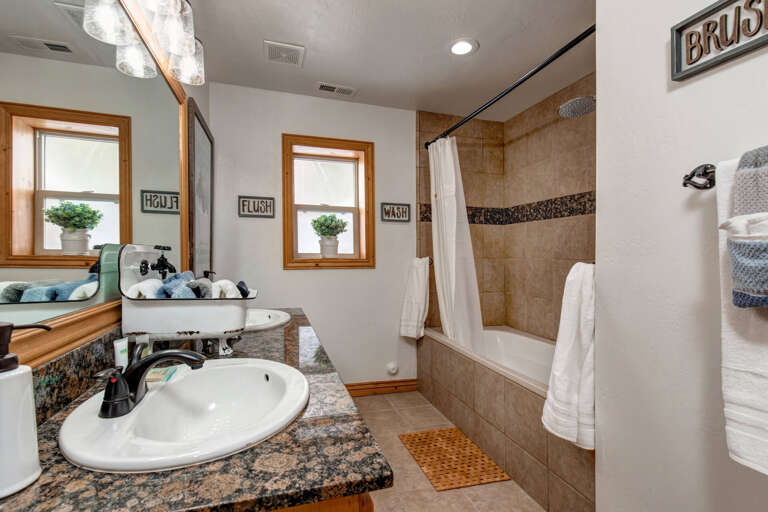 Refresh in your private bathroom with granite counters, a soaking tub, and a separate shower—all accented with cheerful decor and plush towels to welcome you home after a day of adventure.