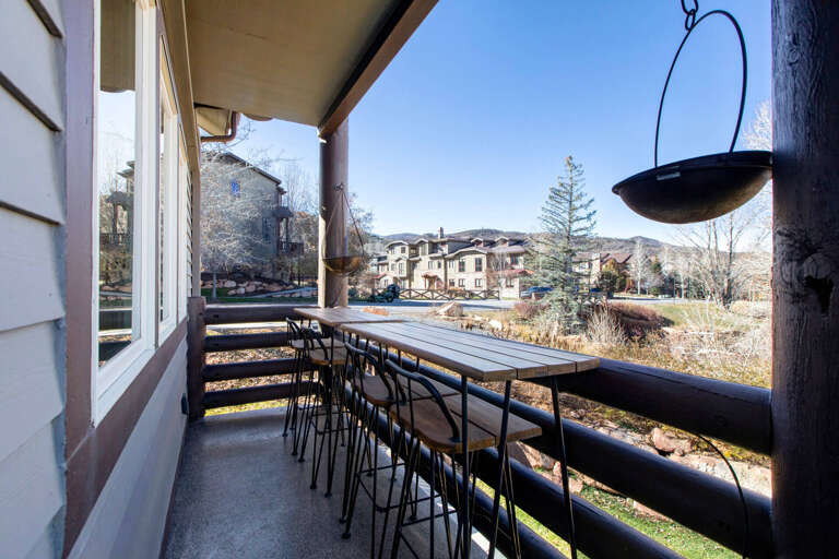 Bear Hollow Village 5534: Main level balcony with seating, natural gas firepit, grill and bar table seating