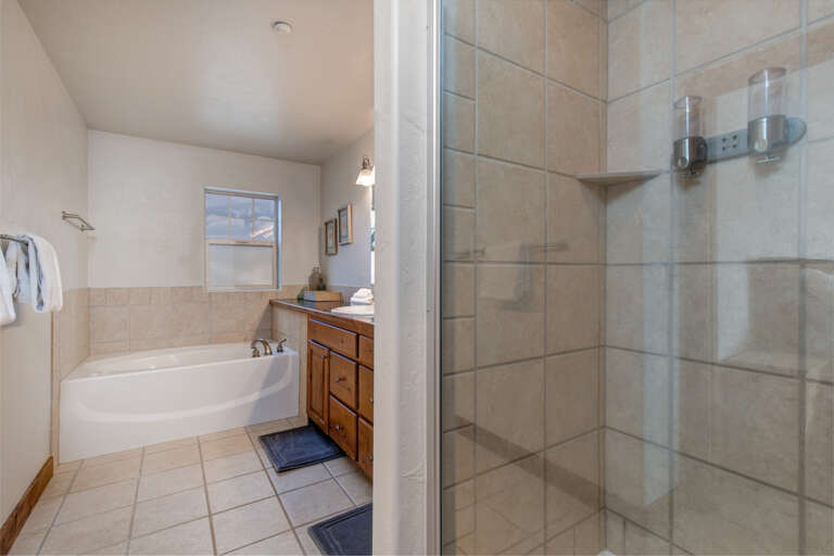 Foxpoint 6195-C2 - Inviting bath space with sink, tub, and shower area.