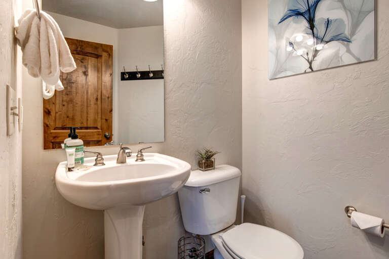 Foxpoint 6195-C2 - A sleek sink next to a tidy toilet in a modern space.