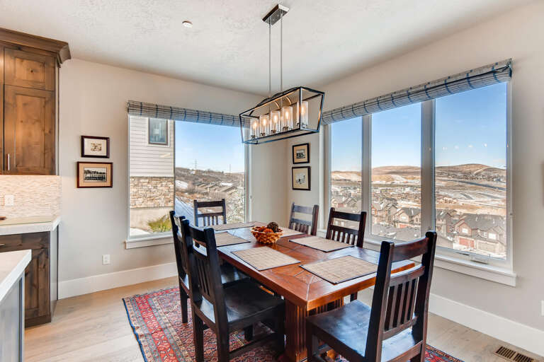 Jordanelle Estates 13299: Dining table: "Sunlit space with a view, perfect for family meals and gatherings."