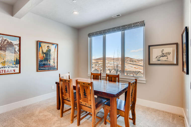 Jordanelle Estates 13299: Dining table: "Sunlit space with a view, perfect for family meals and gatherings."