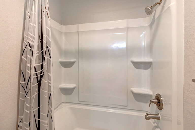 Relaxing tub and shower combo, perfect for unwinding after a long day.