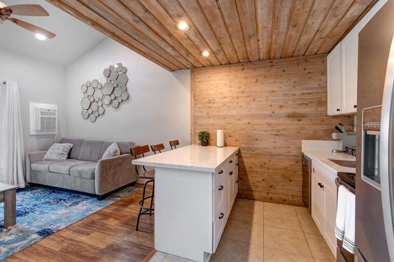 Sleek kitchen counter and cozy bar table for culinary delights.