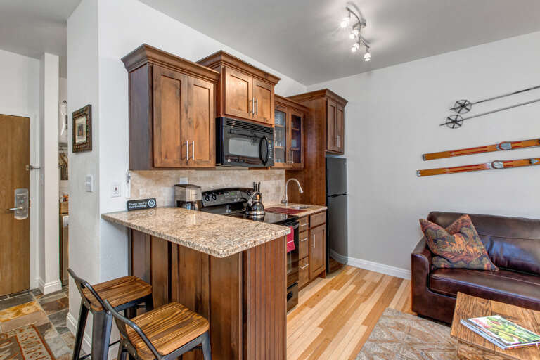 Cozy bar stools by the kitchen bar table, perfect for breakfast Cozy bar stools by the kitchen bar table, perfect for breakfast