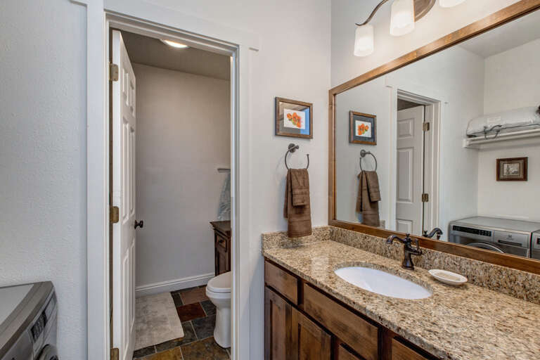 Sleek sink, mirror, toilet, in modern design