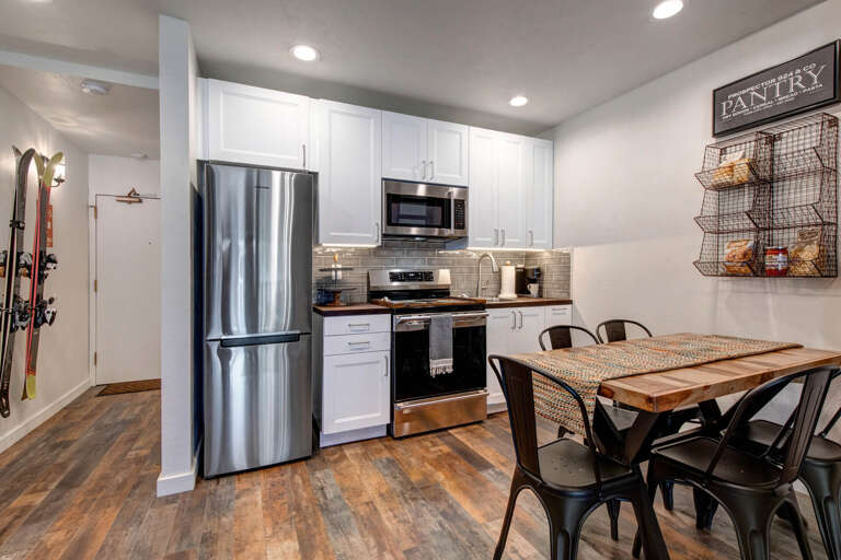 Inviting dining table in a cozy kitchen setting. Inviting dining table in a cozy kitchen setting.