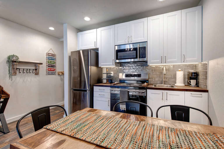 Inviting dining table in a cozy kitchen setting. Inviting dining table in a cozy kitchen setting.