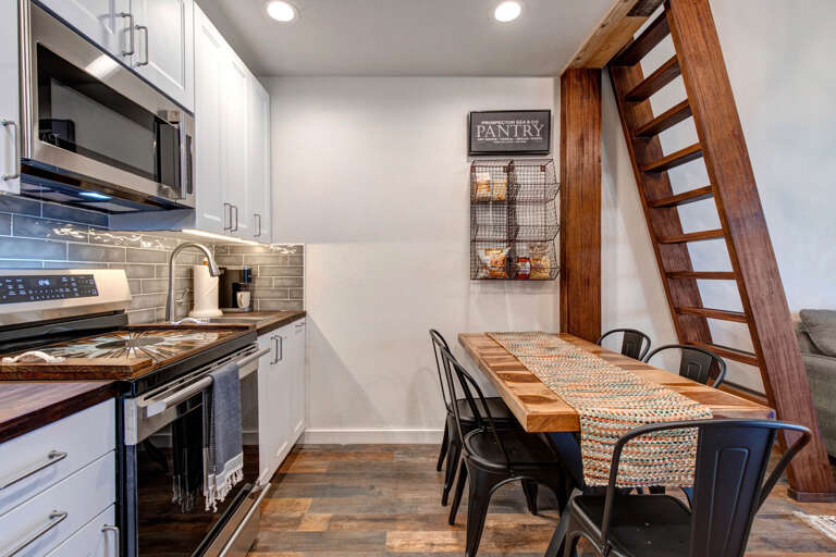 Inviting dining table in a cozy kitchen setting. Inviting dining table in a cozy kitchen setting.