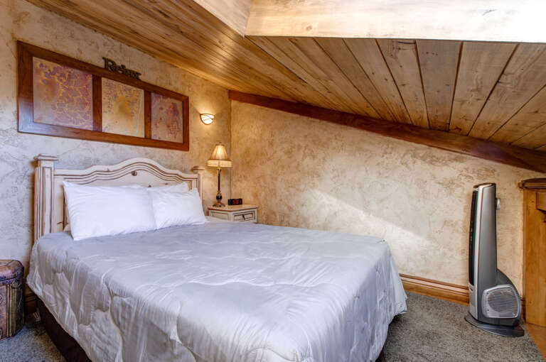 Loft: "Cozy queen bed tucked away under the eaves." Loft: "Cozy queen bed tucked away under the eaves."