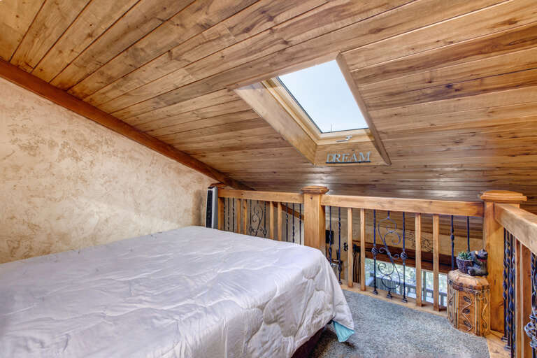 Loft: "Cozy queen bed tucked away under the eaves." Loft: "Cozy queen bed tucked away under the eaves."