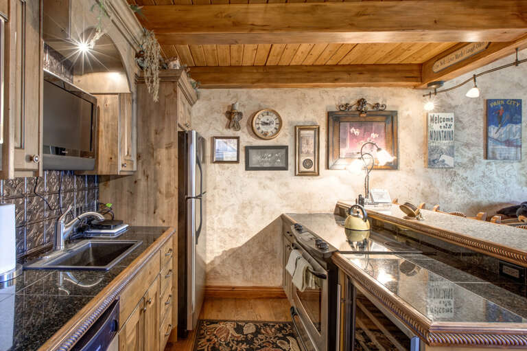 Modern appliances and ample storage in sleek kitchen design. Modern appliances and ample storage in sleek kitchen design.