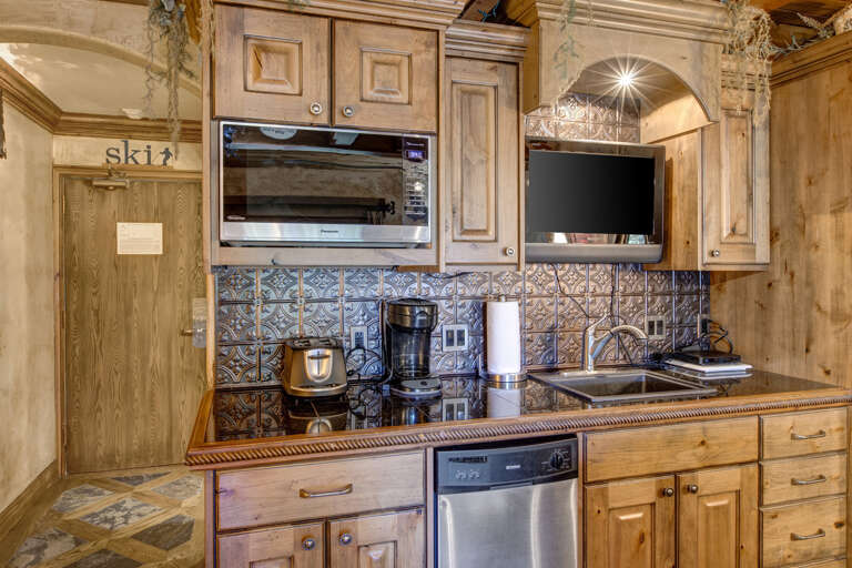 Modern appliances and ample storage in sleek kitchen design. Modern appliances and ample storage in sleek kitchen design.