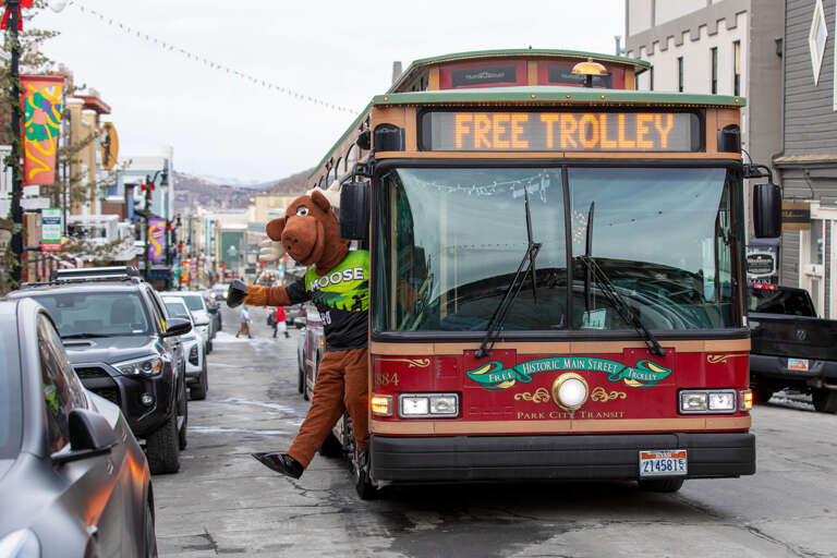 A free trolley winds through Historic Main Street, offering convenient transit through the charming neighborhood lined with shops, restaurants, and mountain views.