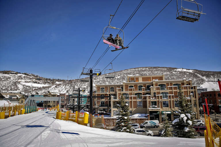 This winter retreat sits right at the base of the ski slopes, where chairlifts glide overhead and snowy mountain adventures begin just steps from the door.