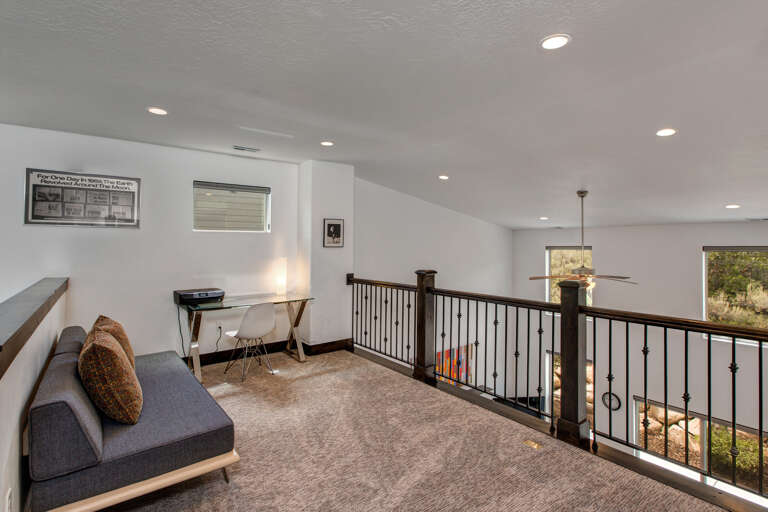 Unwind in your private loft retreat with a sleek workspace, modern furnishings, and peaceful views that invite relaxation and inspiration.
