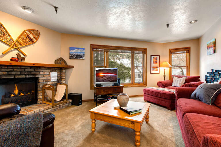 Cozy ambiance with a wood burning fireplace and comfy sofa chairs.