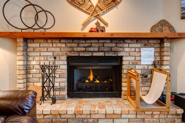 Cozy ambiance with a wood burning fireplace.