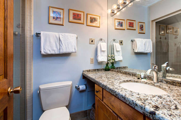 Modern sink and toilet in sleek design.
