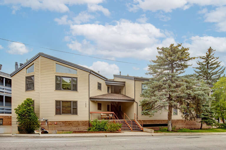 The property sits on a tree-lined street with convenient access and ample natural surroundings, offering a peaceful residential atmosphere near local attractions.