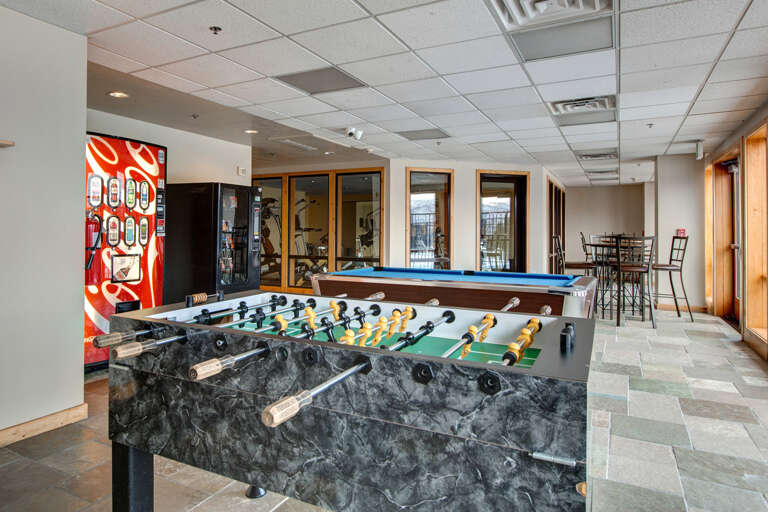 Challenge your crew to a foosball match or rack up for a game of pool in this bright, open game room—complete with high-top seating and a fun vibe.