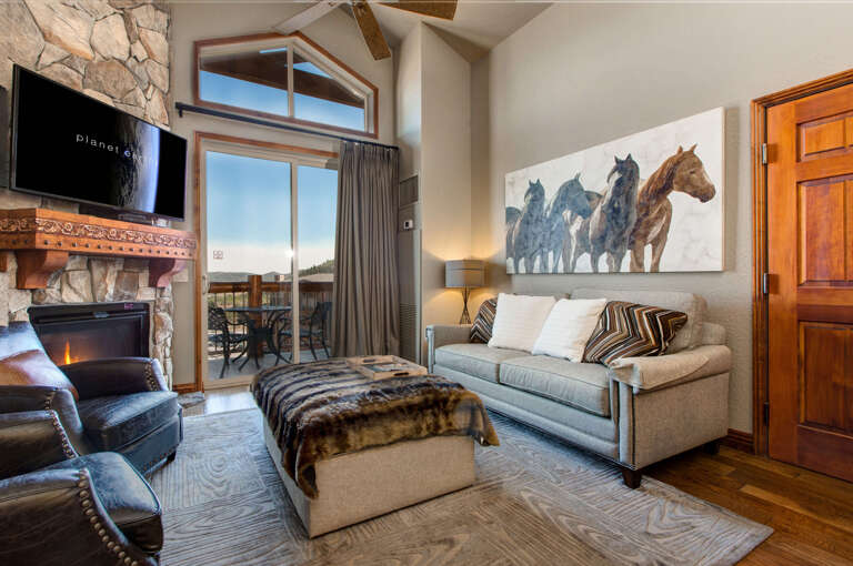 Westgate 3901A: Cozy space with a gas fireplace, sofa set, and outdoor patio.