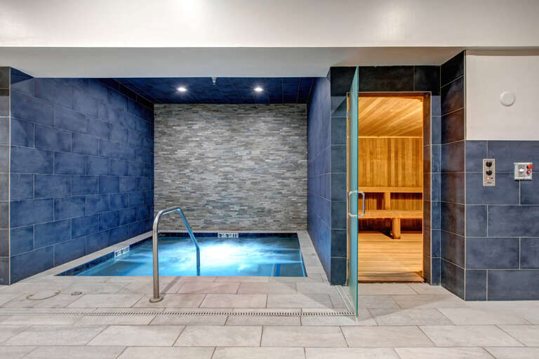 Unwind in the serene spa area, where you'll find a soothing hot tub and a tranquil sauna, both designed to melt away stress and rejuvenate your spirit.