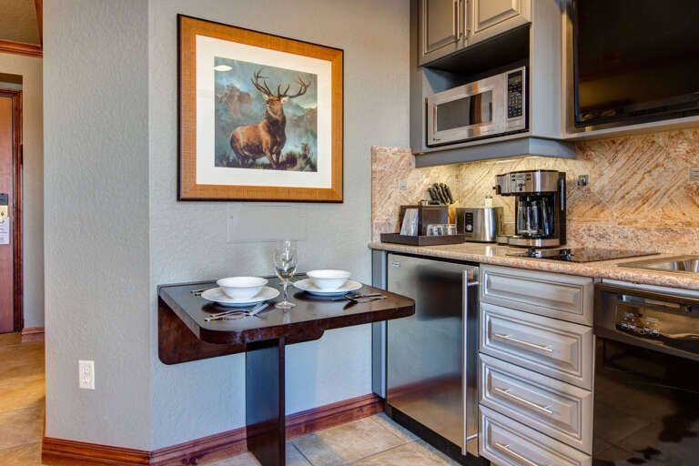 Your cozy kitchenette offers everything you need to prepare light meals, with granite counters, modern appliances, and a charming breakfast nook for two.