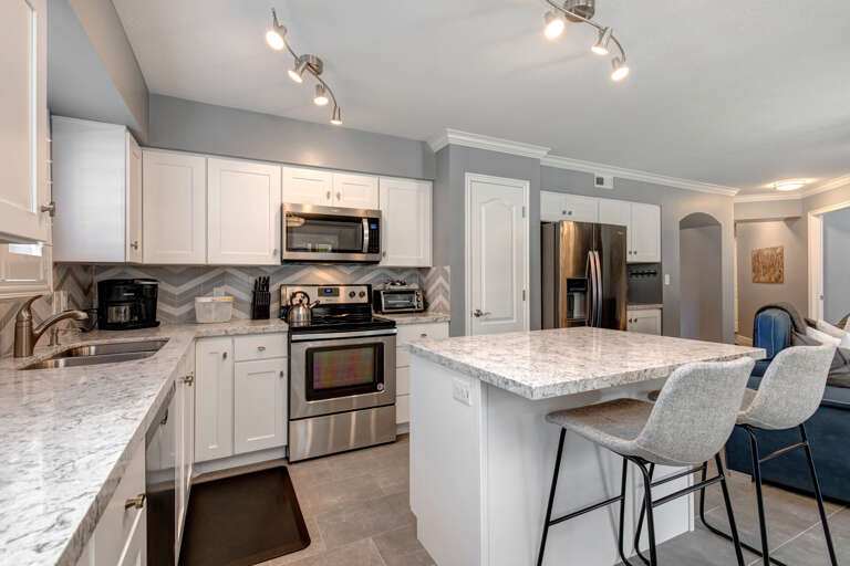 Sleek countertop with modern appliances, perfect for culinary creations.