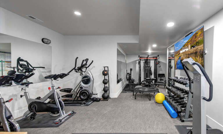 Your private fitness center features stationary bikes, free weights, cable machines, and a mini trampoline—everything you need for energizing workouts during your stay.