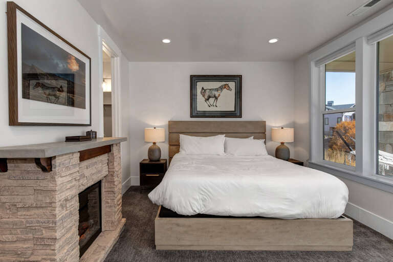 Sink into the plush bed after a day of adventure, with a cozy fireplace at your side and soft lighting to help you unwind completely.