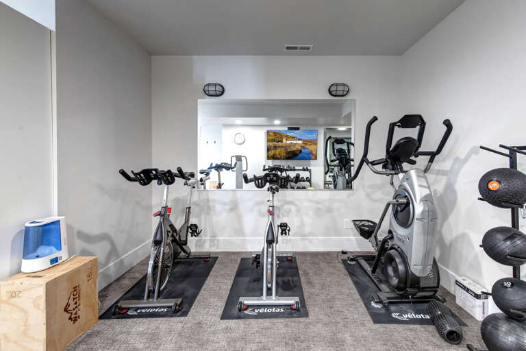 Your private fitness haven awaits with spin bikes, an elliptical, free weights, and a peaceful workout space designed to keep you energized during your stay.