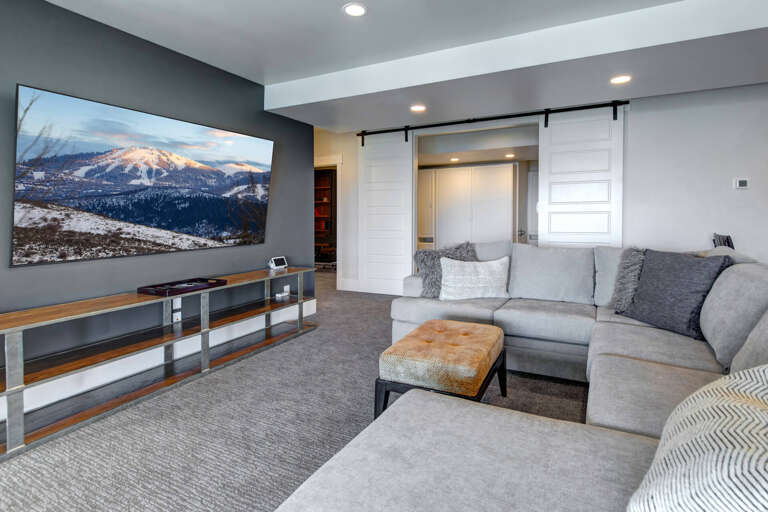 Sink into the plush sectional and enjoy movie nights on your large screen TV, or slide the barn doors open to reveal your cozy Murphy bed ready for restful sleep.