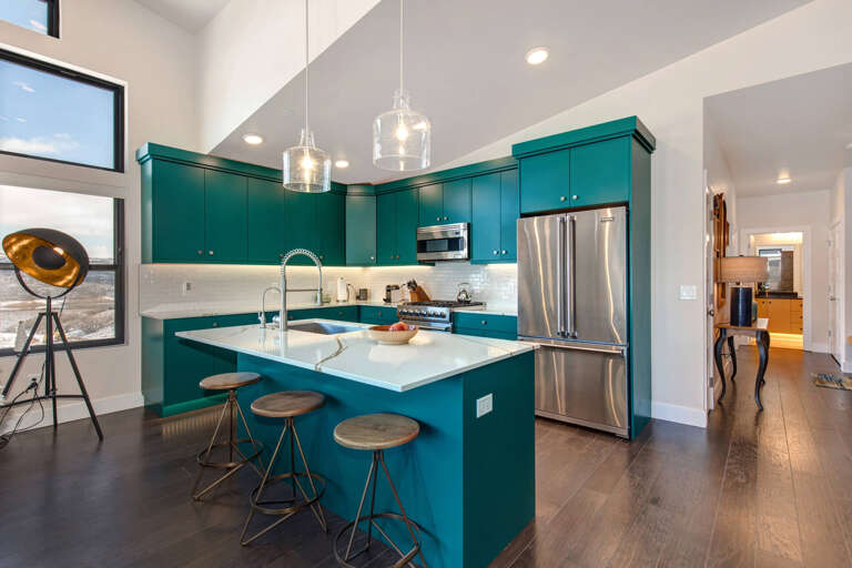 Cozy bar stools by the kitchen bar table, perfect for breakfast. Cozy bar stools by the kitchen bar table, perfect for breakfast.