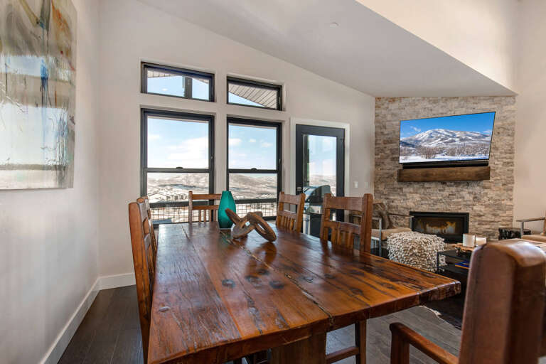 Dining table: "Sunlit space with a view, perfect for family meals and gatherings." Dining table: "Sunlit space with a view, perfect for family meals and gatherings."