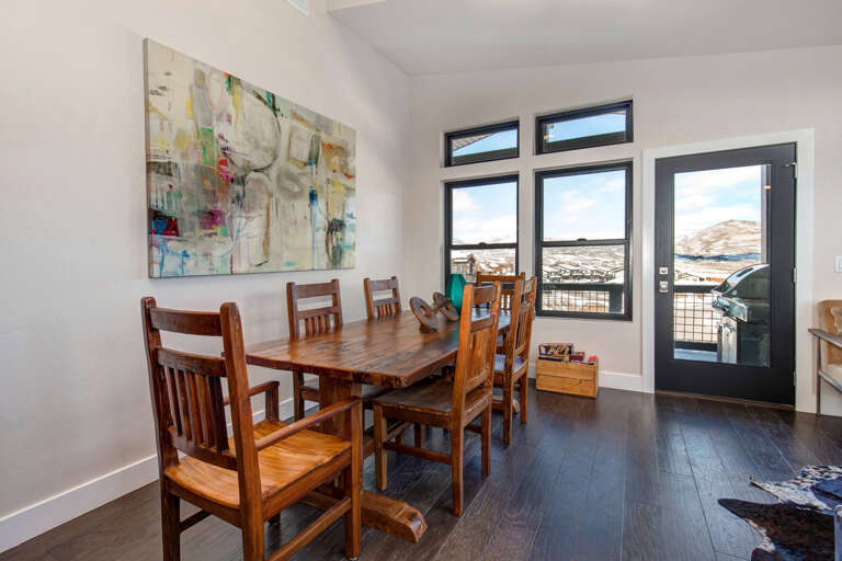 Dining table: "Sunlit space with a view, perfect for family meals and gatherings." Dining table: "Sunlit space with a view, perfect for family meals and gatherings."