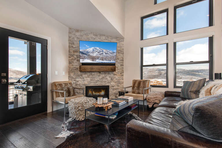 Living Room: "Cozy space with a fireplace, TV, and stylish sofa set." Living Room: "Cozy space with a fireplace, TV, and stylish sofa set."