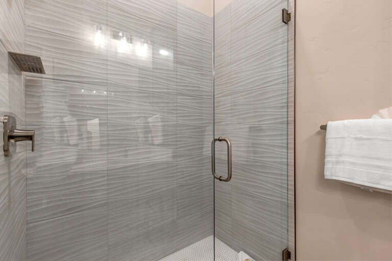 Modern shower with sleek glass enclosure, a perfect oasis for relaxation. Modern shower with sleek glass enclosure, a perfect oasis for relaxation.