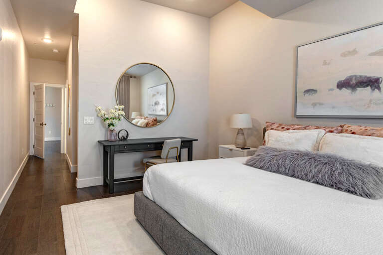 Sink into plush bedding and wake refreshed in your serene retreat. Soft neutral tones, warm lighting, and thoughtful touches create the perfect space to unwind after your adventures.