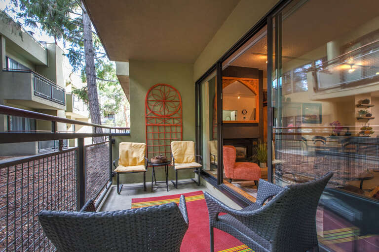 Outdoor Patio: "Inviting outdoor space with four chairs and a red carpet. Outdoor Patio: "Inviting outdoor space with four chairs and a red carpet.