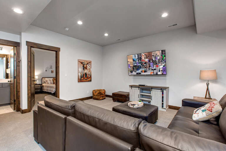 Sink into plush leather sofas in your private lounge, where a flat-screen TV and warm lighting create the perfect space for movie nights and relaxing evenings together.