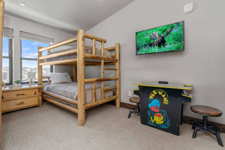 Bunk Bed: "Cozy retreat with arcade games for endless fun and relaxation." Bunk Bed: "Cozy retreat with arcade games for endless fun and relaxation."
