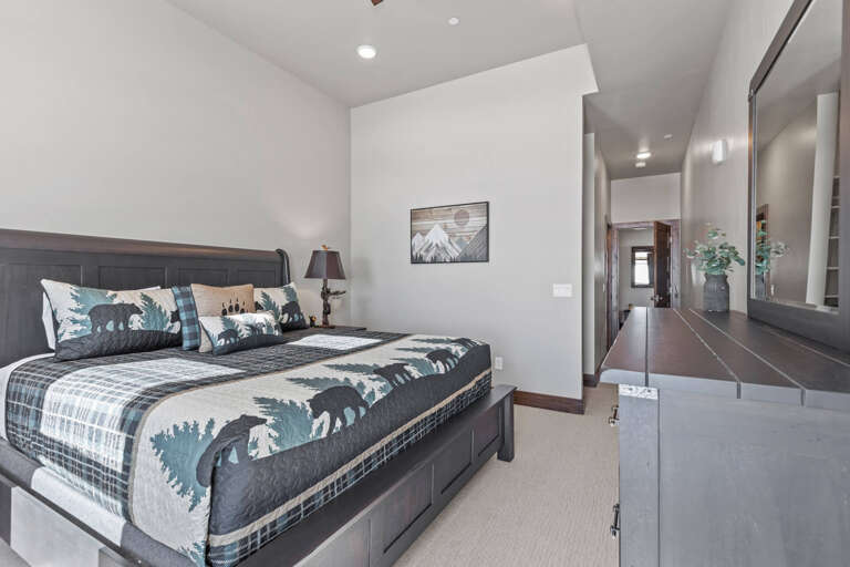 Cozy bed with natural light streaming through the windows. Cozy bed with natural light streaming through the windows.