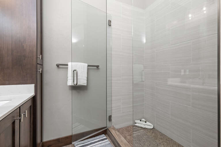 Modern shower with sleek glass enclosure, a perfect oasis for relaxation. Modern shower with sleek glass enclosure, a perfect oasis for relaxation.