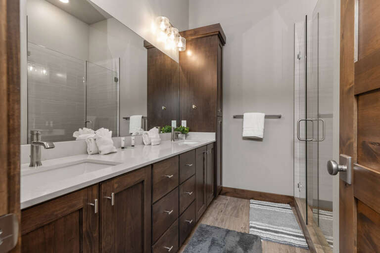 Modern sink and spacious shower area in this cozy room. Modern sink and spacious shower area in this cozy room.