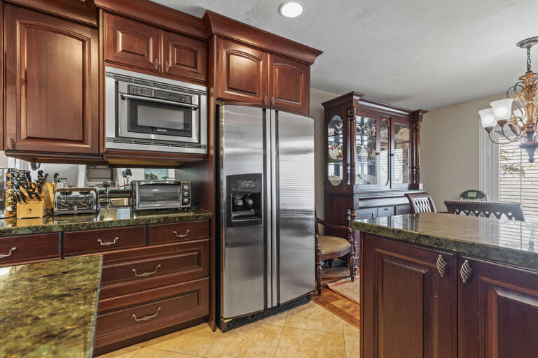 Modern appliances and ample storage in sleek kitchen design.