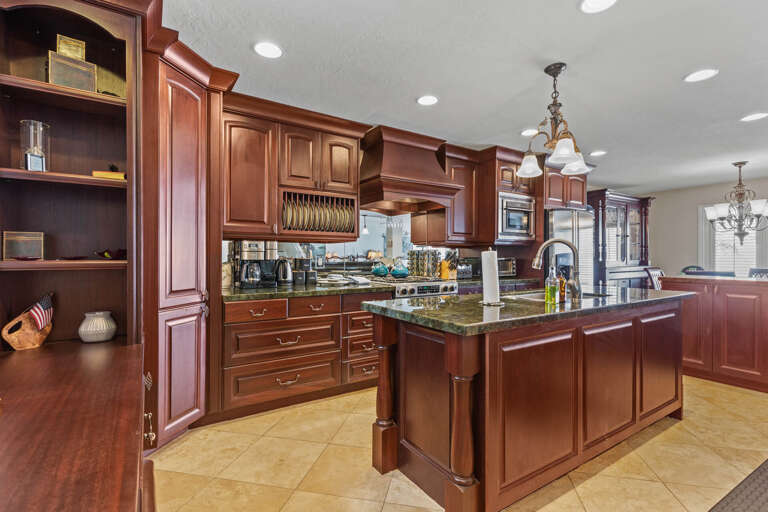 Modern appliances and ample storage in sleek kitchen design.
