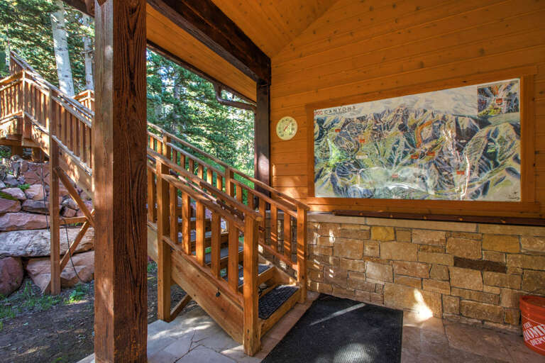 Step into your mountain retreat through this inviting entrance, where warm wood tones and forest views welcome you home.