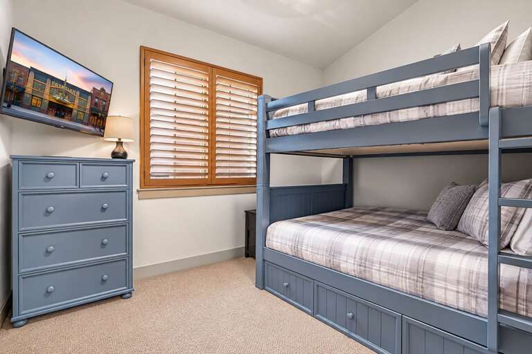 Rest easy in this cozy bedroom with comfortable bunk beds and plenty of storage for your belongings.